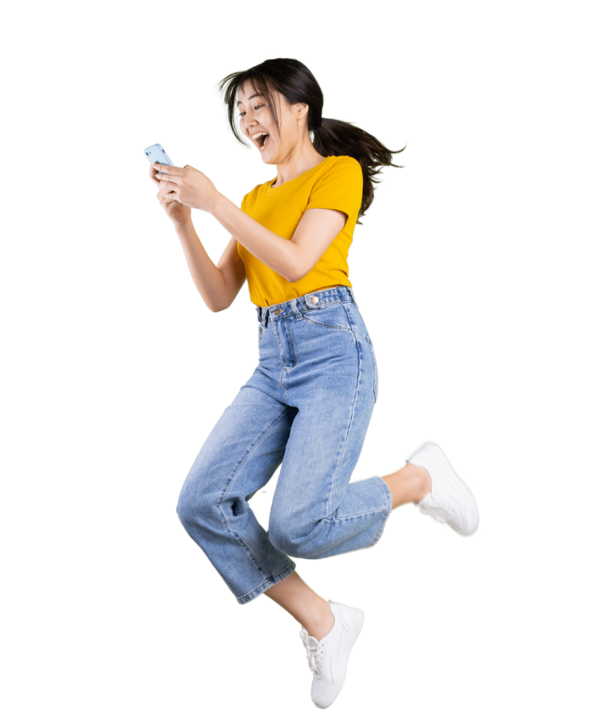 woman in yellow jumping with excitement while looking at phone