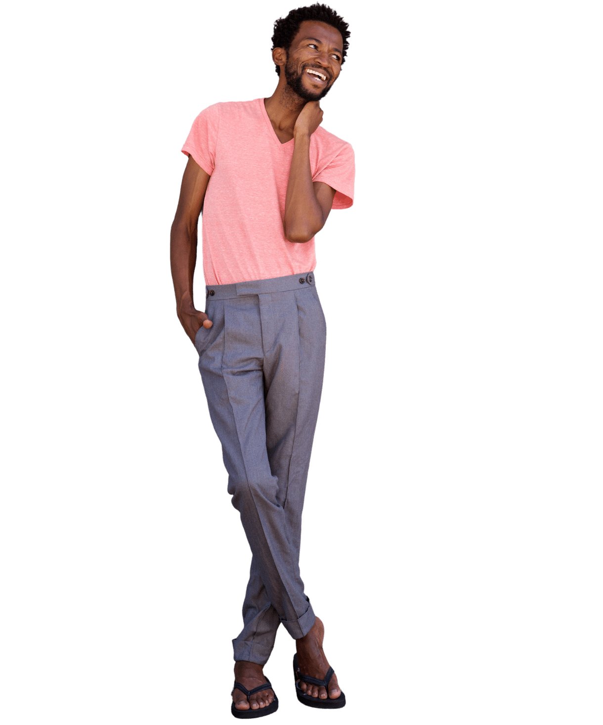 man in pink shirt and slacks leaning sideways