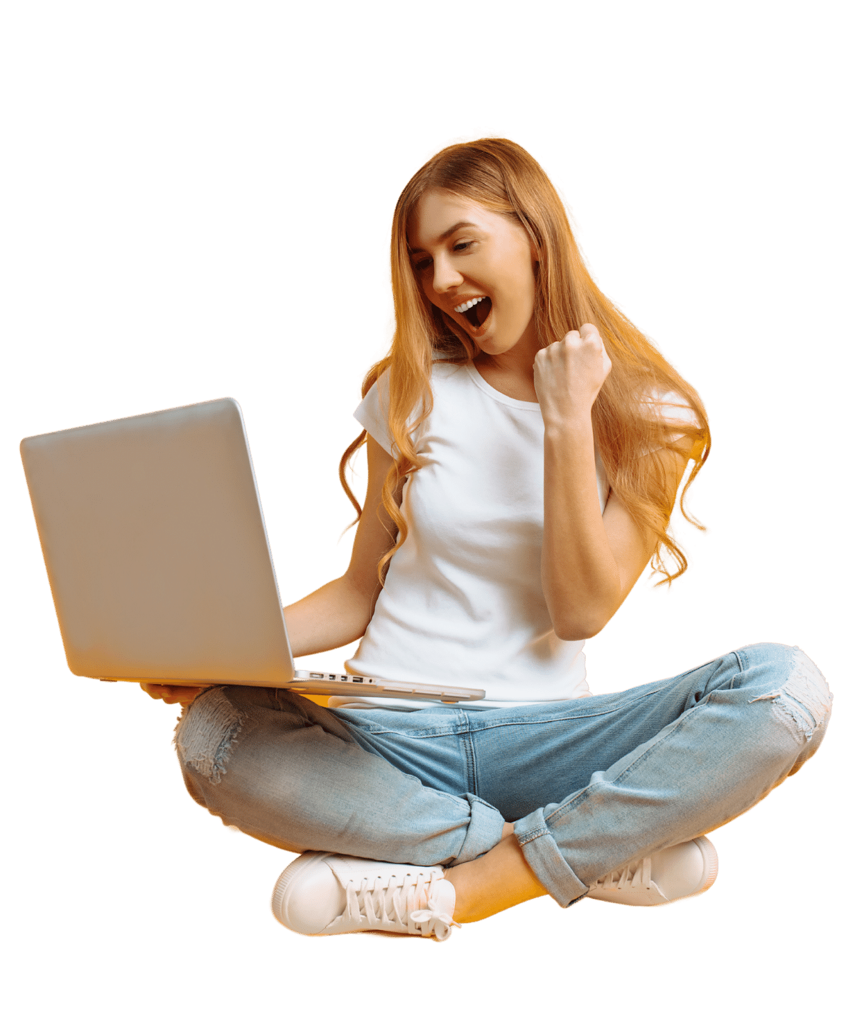 Blond girl in white shirt and blue jeans sitting crosslegged and smiling at her laptop.