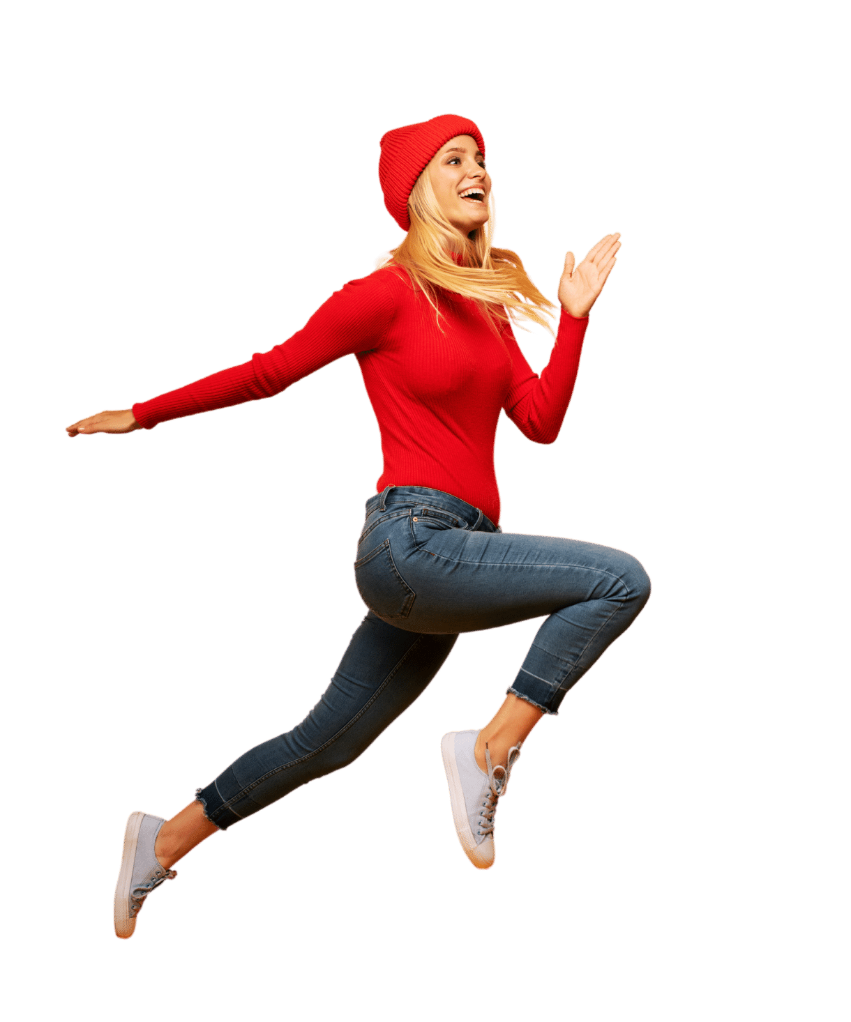 girl in red sweater and red hat jumping through the air while smiling