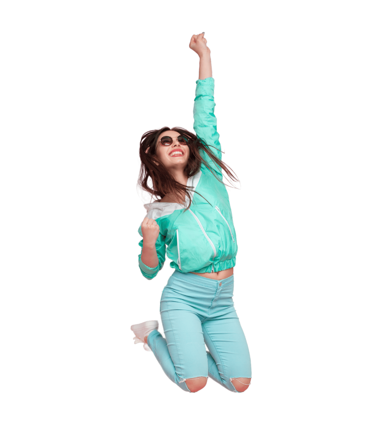 Woman in green hoodie and sunglasses jumping into air with one hand raised and smile on her face